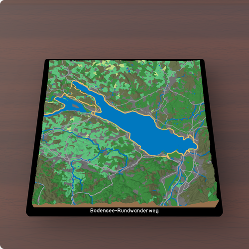 Bodensee, Dreiländereck: das gedruckte Gelände mit dem Weg „Bodensee-Rundwanderweg" auf einem Couchtisch, 250 mm.